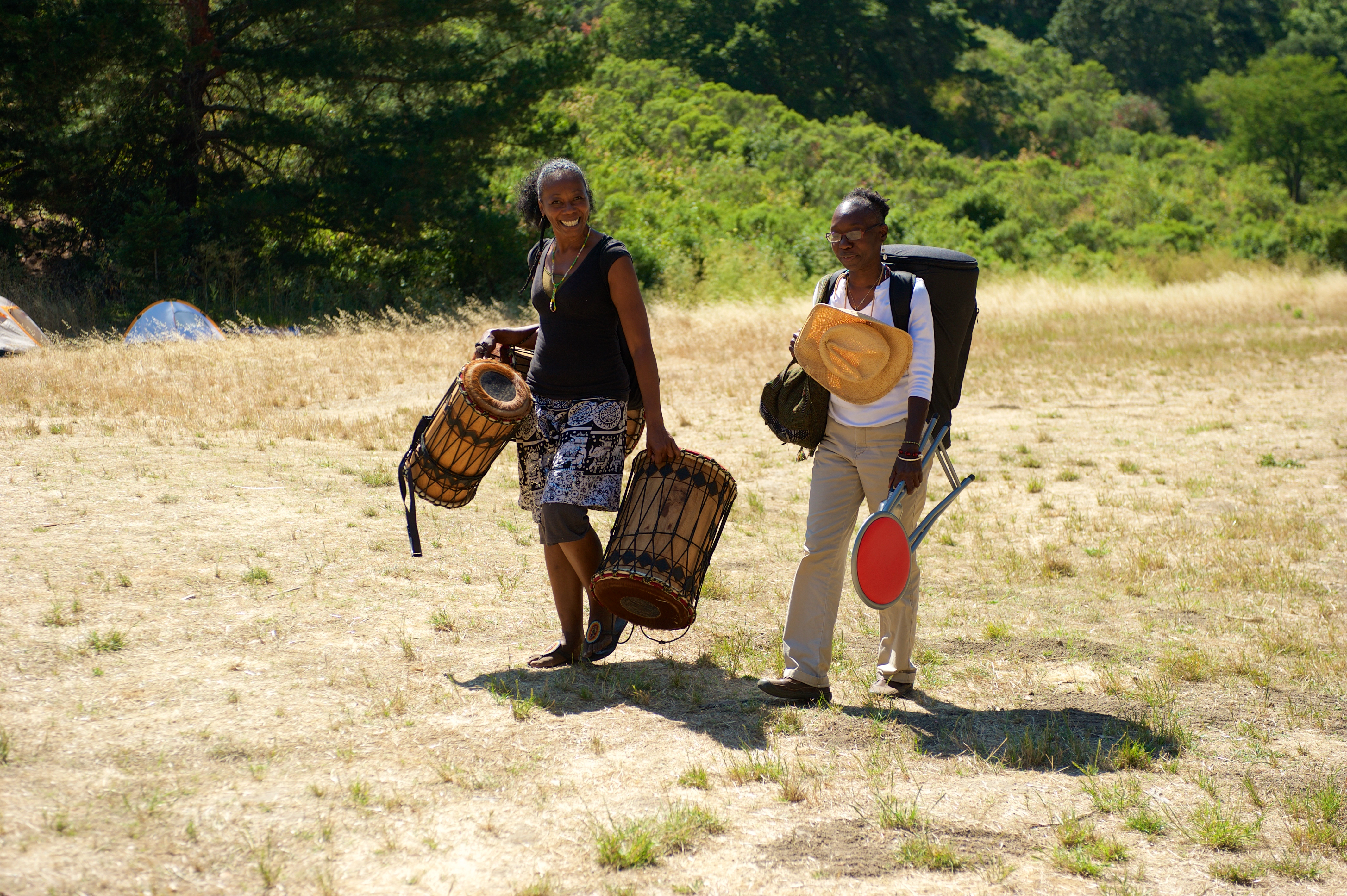 carrying drums Ouida & Char