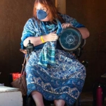 Lg-woman-at-drum_374x500px